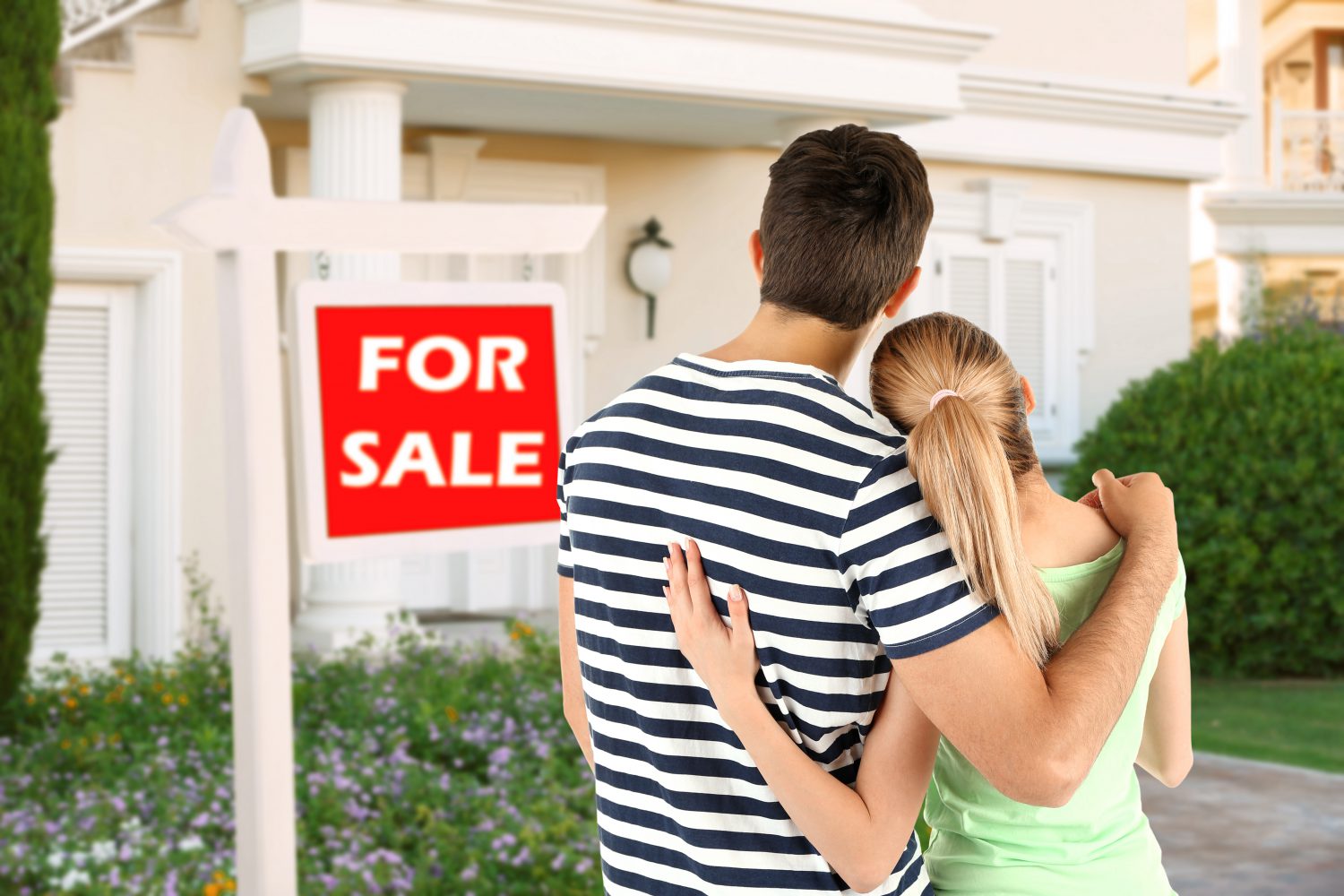 Loving couple looking at their dream house